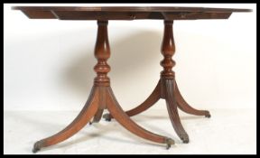 A 20th Century mahogany regency revival twin pedes