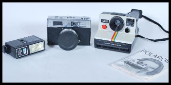 Two vintage film cameras to include a Polaroid Land Camera 1000 and a Halina 3000 film camera with a