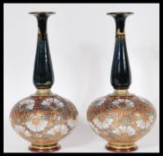 A pair of Royal Doulton Slater onion shaped stoneware vases, each with impressed marks to the base