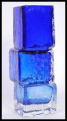 A blue Whitefriars style drunken bricklayers shaped vase, formed as three offset bricks, centre