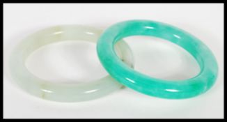 A Chinese rich green  jade bangle / bracelet together with another jade mottled light green
