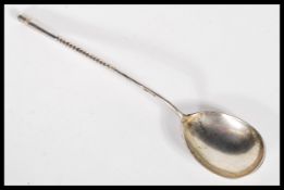 A 19th Century Russian silver coffee / tea spoon having an elongated stem with central twist.