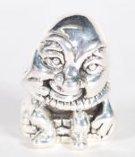 A sterling silver figurine pincushion in the form of humpty dumpty. Weighs 13 grams.