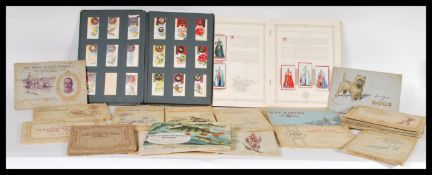 A collection of complete and incomplete cigarette card albums from Wills Cigarettes, John Players to