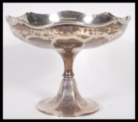 A silver hallmarked pedestal bowl, the scalloped bowl raised on a pedestal base etched to the inside