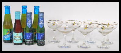 A collection of seven retro and vintage Babycham advertising point of sale glasses together with a