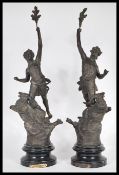 A pair of 19th century Art Nouveau French spelter figurines kneeling on stags, each with notation