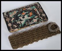 An early 20th Century Chinese silk embroidered clutch bag, embroidered with a ho ho bird and flowers
