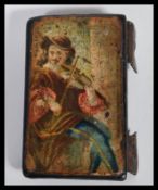 An 18th /19th Century lacquered hand painted top of a snuff box, the lid painted with a musician