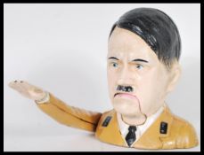 A WWII related vintage cast iron cold painted novelty nut cracker in the form of Adolf Hitler having