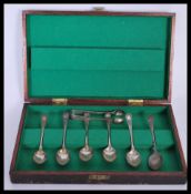 A cased set of 19th Century silver hallmarked teaspoons by John Roberts having engraved florals to