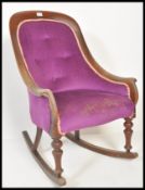 A 19th Century Victorian rocking chair raised on sleigh rockers and turned legs. The vibrant Royal