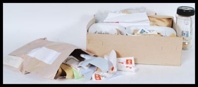 A collection of kiloware British 20th and 21st century stamps. Comprising of various local