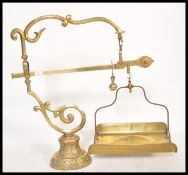 A large and impressive 19th Century French brass set of weighing scales raised on pedestal relief