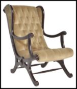 A Regency revival 20th Century chesterfield button back slipper chair, raised on an ebonised