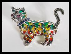 A sterling silver plique a jour brooch in the form of a cat. Weighs 10 grams.