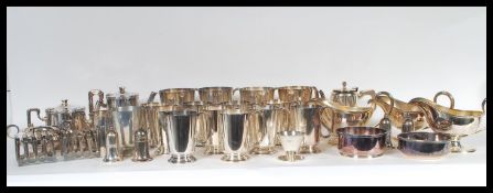 A collection of vintage 20th century silver plated hotel ware to include gravy boats, goblets, toast