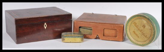 A good selection of early 20th century and later buttons set within a Victorian mahogany workbox