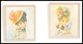 Two vintage 1960's /70's retro Strev prints of little girls holding puppies within white frames.