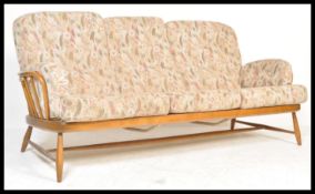 Ercol - A golden dawn Windsor pattern three seater sofa / settee in beech and elm having shaped
