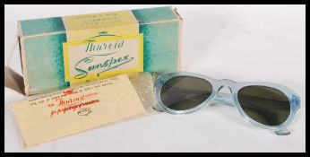A pair of vintage mid century Thuroid Sunspex ladies sunglasses complete in the original packaging.