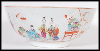 An 18th Century Chinese porcelain bowl having hand painted decoration depicting court scenes with