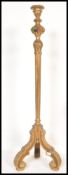 An early 20th Century Edwardian standard lamp raised on scrolled leg with gilt acanthus leaf
