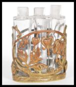 A vintage early 20th Century Art nouveau style three sectioned perfume bottle in the manner of