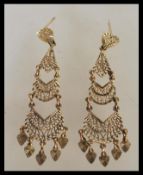 A pair of 9ct gold filigree ladies drop earrings constructed from three graduating sections with