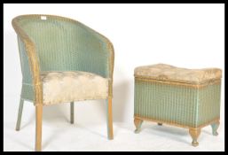 A vintage mid century two tone Lloyd Loom lustre whicker armchair and ottoman basket stool with