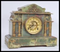 A Victorian 19th century green marble American Ansonia mantel clock having inset 8 day movement,
