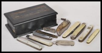 A collection of vintage 20th Century folding penknives to include a silver bladed fruit knife with