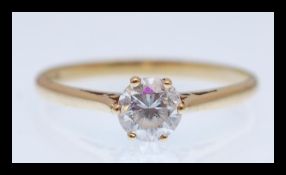 A hallmarked 9ct gold solitaire ring set with a brilliant cut white stone. Hallmarked Sheffield.
