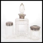 A early 20th century silver topped, cut glass perfume bottle with a glass stopper, makers mark