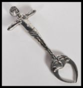 A pair of Novelty Art Nouveau silver plated sugar tongs in the form of an exercising gentleman,
