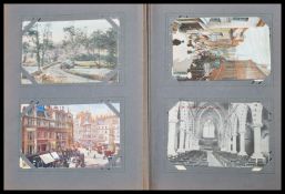 A vintage 20th Century postcard album containing p