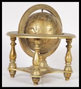 A vintage 20th Century heavy cast brass desktop globe raised on brass stand. 21cm high 19cm