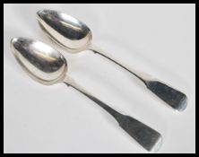 A pair of early 19th Century Georgian George IV large serving or basting spoons in the fiddle
