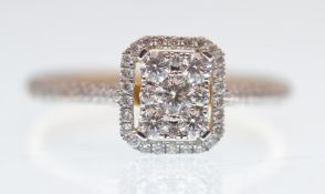 AN 18CT WHITE GOLD AND DIAMOND LADIES CLUSTER RING