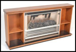 A vintage retro mid 20th Century teak wood firepla