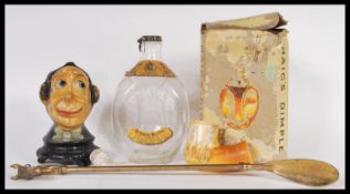 A vintage early 20th Century money box depicting the bust of a gent in bow tie raised on a socle