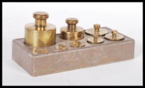 A set of early 20th Century graduating brass weigh