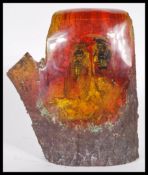 A pair of taxidermy Cicadas being set in an amber style resin modelled as a tree stump. 18cm high