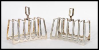 A pair of early 20th Century silver plated toast r