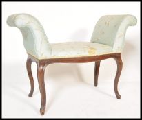 An early 19th Century Georgian mahogany piano stool or window seat raised on cabriole legs with