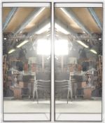 A PAIR OF LARGE 20TH CENTURY INDUSTRIAL SHOP MIRRORS