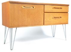 A MID CENTURY TEAK WOOD HAIRPIN LEG SIDEBOARD CREDENZA