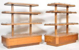 A PAIR OF MID CENTURY BRITISH OAK SHOP PAGODA DISPLAY STANDS