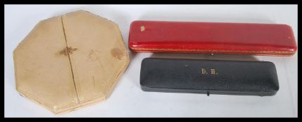 A selection of vintage jewellery boxes to include a black leatherette box having a velvet and silk