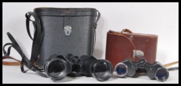 Two pairs of vintage 20th Century binoculars to include a pair of Carl Zeiss Jena Jenoptem 8x30 W